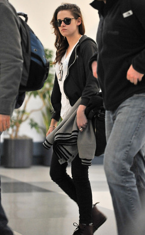 Kristen Stewart arrives at LAX behind a pair of sunglasses. Kristen Stewart arrives at LAX behind a pair of sunglasses.